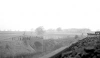 Looking north west towards Roxburgh along the Kelso line in 1966, with the embankment carrying the Jedburgh branch coming in on the left. [Ref query 6406]<br><br>[Bruce McCartney //1966]