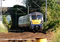 334006 has just passed below Ferry Road bridge and is approaching Bainfield foot crossing (Cardross) on 31 May 2014 with a Waverley to Helensburgh Central service.<br><br>[John McIntyre 31/5/2014]