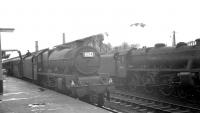 The 8.50am Blackpool - Glasgow Central has recently arrived at Carlisle platform 1 on 24 August 1963. Jubilee no 45703 <I>Thunderer</I> off Blackpool Central shed (24E) is taking on water while mail and parcels are being trans-shipped.<br><br>[K A Gray 24/08/1963]