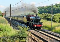 Carnforth shed rostered 45699 <I>Galatea</I> for the second 2014 <I>Fellsman</I> and the maroon <I>Jubilee</I> is seen hurrying the train south through Woodacre on a sunny 18th June. <br><br>[Mark Bartlett 18/06/2014]