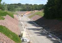 Looking north along the Waverley trackbed from the site of Tynehead station on 19 June 2014. A new farm access overbridge will appear in the background in due course.<br><br>[John Furnevel 19/06/2014]