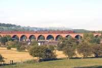 In glorious evening sunshine, Jubilee 4-6-0 45699 <I>Galatea</I> crosses Whalley viaduct with the returning <I>Fellsman</I> on 18 June 2014. The tour had been running late but was making up for lost time and the regulator was opened once off the viaduct and climbing Wilpshire bank.<br><br>[John McIntyre 18/06/2014]