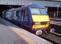 The only DRS electric locomotive, 90034, enjoys the evening sunshine (notice both cab sunblinds are fully down) on 12 June, as it prepares to take the Virgin Mark 3 set from Euston to Birmingham.<br><br>[Ken Strachan 12/06/2014]