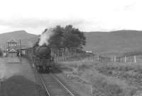 Photograph taken from the 10.05 ex-Glasgow Queen Street running into Corrour in 1961. Standing at the platform waiting to cross with a southbound freight is B1 61278.    <br><br>[David Stewart //1961]