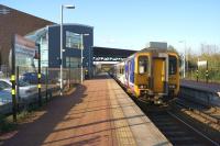 A Northern service from Liverpool to Wigan calls at the modern St Helens Central station on the evening of 19 April 2014.<br><br>[John McIntyre 19/04/2014]