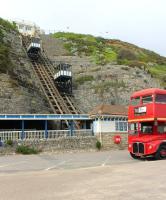 Eastcliff is the oldest of Bournemouth's three cliff railways, but only by three months, having opened in April 1908. It is also the tallest, rising to 170' above the East Promenade on a gradient of almost 1:1. Seen here in May 2014, the Routemaster bus was in town for the annual <I>Wheels Festival</I>. <br><br>[Mark Bartlett 23/05/2014]