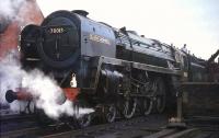 Britannia 70013 <I>Oliver Cromwell</I> takes on water at Wigan North Western on 13 April 1968. The Pacific was on its way from Stockport to Carnforth with a return leg of the BR (Scottish Region) <I>Easter Grand Tour</I> from Edinburgh.  <br><br>[G W Robin 13/04/1968]