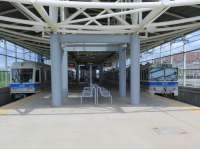 Clareview, the northern terminus of the Edmonton LRT system, sees a 2009 built Siemens SD160 unit, mainstay of services, alongside a now rarely seen 1978 built U2 unit waiting to depart for Century Park.<br><br>[Malcolm Chattwood 13/06/2014]