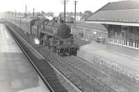 BR Standard class 4 2-6-0 76107 entering Kittybrewster station on 19 August 1959 with an Elgin - Aberdeen (via coast) service. The locomotive has just passed its home shed off picture to the left. <br><br>[G H Robin collection by courtesy of the Mitchell Library, Glasgow 19/08/1959]