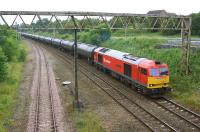 An unusual working for a Saturday was the Lindsey Refinery to Preston Docks bitumen tanks. On 28 June 2014 DBS 60062 brings the 6E32 return empties off the WCML at Farington Curve Junction and onto the East Lancs line towards Blackburn. The Ormskirk line is on the left.<br><br>[John McIntyre 28/06/2014]