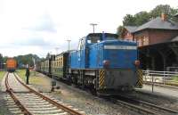 The holiday island of Ruegen features an interesting mix of diesel, electric and steam traction. Here at the Putbus junction of the 750mm gauge Ruegensche Baederbahn and the standard-gauge branch from Bergen auf Ruegen, the two tracks merge into a dual-gauge final 5.8 kms to the terminus at Lauterbach Mole. On 12th June, a service from Goehren to Lauterbach is topped by narrow-gauge steam and tailed by a Class 251 narrow-gauge diesel of the Pressnitztalbahn operating company.<br><br>[David Spaven 12/06/2014]