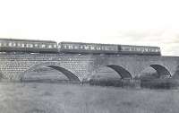 View west showing a DMU forming a down Buchan line train crossing the River Don on Parkhill Viaduct, north of Dyce, in the summer of 1960. <br><br>[G H Robin collection by courtesy of the Mitchell Library, Glasgow 15/08/1960]