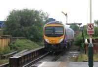 Following the May timetable changes the North East - Liverpool Trans Pennine services are diverted to run through Manchester Victoria rather than Piccadilly. 185147 heads west on the <I>new</I> route at Ashton-under-Lyne. The distant signal is for Ashton Moss North Junction, where the freight only line from Heaton Norris joins this line. <br><br>[Mark Bartlett 09/06/2014]