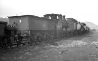 Lineup of stored locomotives at Llandudno Junction on 1 April 1963. Nearest the camera is ex-LYR 0-6-0 52119, while beyond are Stanier 3Ps 40093 and 40122.<br><br>[K A Gray 01/04/1963]