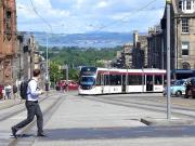 Still turning heads - thankfully - Edinburgh tram 277 enters North St Andrew Street from York Place on 1 July.<br><br>[Bill Roberton 01/07/2014]