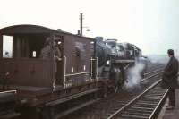 BR Standard class 3 2-6-0 no 77012 with the <I>Scottish Rambler no 5</I> brakevan tour of 8 April 1966. The photograph is thought to have been taken at Cleland during a photostop on the trip from Springburn to Polkemmet Colliery. [Ref query 10138]  <br><br>[G W Robin 08/04/1966]