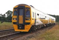 Northern 158849 re-liveried in a yellow scheme with <I>TAKING YOU TO THE TOUR</I> lettering along the lower bodyside. The branding has been applied in connection with the <I>Grand Depart</I> of the <I>Tour de France</I> in Yorkshire on 5 and 6 July 2014. Extra trains will help people get to the event and both Northern and First TPE have leased loco hauled coaches to supplement regular workings. 158849 is heading east at Gregson Lane on 2 July with an evening Blackpool - York service. <I>Bonsoir</I>.<br><br>[John McIntyre 02/07/2014]