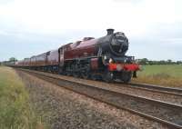 The return working of <I>The Fellsman</I> railtour at Gregson Lane between Blackburn and Preston on 2 July 2014. Jubilee 4-6-0 no. 45699 <I>Galatea</I> is coasting at this stage, with the special running around 10 minutes early.<br><br>[John McIntyre 02/07/2014]