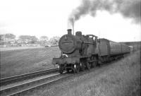 The 4.13pm Glasgow St Enoch - Kilmarnock passing Kennishead Road bridge in September 1960 behind Corkerhill class 2P 4-4-0 no 40613.  <br><br>[David Stewart 13/09/1960]