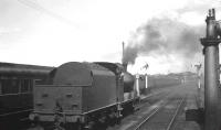 No 48 photographed standing just outside Portadown station in the summer of 1965, with the driver having a word with the signalman in Portadown North box.<br><br>[K A Gray 28/08/1965]