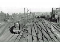 Royal Scot 46165 <I>The Ranger (12th London Regt.)</I> runs west past Polmadie shed on 29 July 1963 with a train from North Wales.  <br><br>[John Robin 29/07/1963]