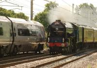A1 Pacific 60163 <I>Tornado</I> charges north at Balshaw Lane Jct on 5 July 2014 as it meets a Glasgow to London Virgin Pendolino at a closing speed of almost 200 mph whilst working the UK Railtours <I>Border Raider</I>. The tour had started in London and the A1 took over from a Class 90 for the run north over Shap to Carlisle.<br><br>[John McIntyre 05/07/2014]