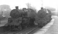 Side by side. 80046 and 73079 stand together at St Enoch in the early 1960s.  <br><br>[David Stewart //]
