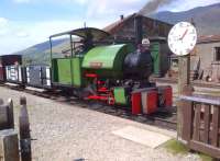 There is something a bit Wild West about this image of <I>Sir Tom</I> waiting to take passengers up the hill from the halt by the car park at Threlkeld. The one handed clock certainly takes some getting used to. <br><br>[Ken Strachan 18/05/2014]