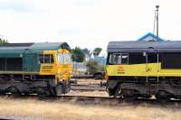 Freightliner 66564 and Colas Rail 66848 standing in the station sidings at Eastleigh on 9 July 2014.<br><br>[Peter Todd 09/07/2014]