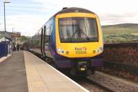 TransPennine 170306 calls at Stalybridge platform 1 on 5 July 2014 with a Hull to Manchester service.<br><br>[John McIntyre 05/07/2014]
