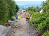 View south from the A6094 road bridge on 6 July past the site of Hardengreen Junction towards the works underway on the new Eskbank station, with the partially constructed footbridge at the south end.<br><br>[John Furnevel 06/07/2014]