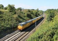 Brush Type 2 31233 propels a Network Rail test train from Derby to Carlisle north through the cutting at Forton, near Bay Horse, on a hot and sunny 10th July 2014. <br><br>[Mark Bartlett 10/07/2014]