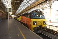 The 6J37 Carlisle - Chirk loaded logs saw the debut of a Colas Rail Class 70 operating the train between Carlisle and Warrington on 10 July 2014. The train also included 66847 dead behind 70802 and is seen here heading south at Preston.<br><br>[John McIntyre 10/07/2014]