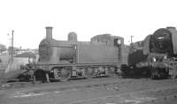 Class 3F 0-6-0T 47236 sandwiched between a snow plough and Stanier Pacific 46244 <I>King George VI</I> in the shed yard at Kingmoor on 15 May 1964.<br><br>[K A Gray 15/05/1964]