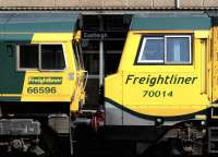 Freightliner locomotives 70014 and 66598 bound for Southampton alongside the platform at Eastleigh on 9 July 2014.<br><br>[Peter Todd 09/07/2014]