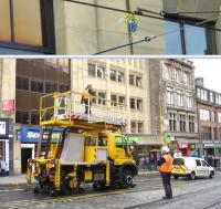 Tram stop! The overhead line team of Edinburgh Trams removing wayward balloons from the catenary in South St Andrews Street on 14 July. The operation itself took less than 20 seconds, though related activities, including arranging for isolation of the 750Volt DC overhead power supply, took considerably longer.  <br><br>[David Pesterfield 14/07/2014]