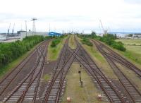 There are no less than four separate sets of tracks into the Sassnitz Mukran ferry complex on Ruegen - this is the non-electric broad-gauge access serving train ferries to Lithuania and Russia, bereft of traffic on 19th June. Sassnitz Mukran is the largest railway port in Germany, with a total track length of 30kms broad-gauge and 60kms standard-gauge in the port and adjacent marshalling yard / rail works.<br><br>[David Spaven 19/06/2014]