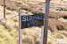 The trackbed of the line over Dava Moor has largely been incorporated into the Dava Way. Between Grantown-on-Spey and Dava the line climbed to a height of 1052 feet, a summit still marked by this (easily missed) sign. [See image 26650] <br><br>[John Gray 20/04/2014]