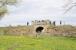 Surviving accomodation bridge on the west side of the S & D Brusselton Incline between Shildon and West Auckland, built 1825. The listed bridge has been damaged by masonry removal but is now in the care of the Brusselton Incline Group. Trees and shrubs have been removed from the embankment between the bridge and Brusselton incline top, exposing a number of the original stone block sleepers.<br><br>[Brian Taylor 03/05/2014]