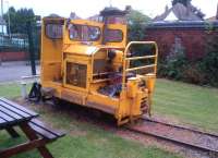 At last, the inspiration for the styling of the Class 70 is revealed. This Simplex loco was built in 1979 by Motor Rail of Bedford, and spent its working life holding its nose at the Minworth sewage works railway, near Sutton Coldfield. There is a similar loco in the Grain Store on the Statfold Barn railway [see image 46848]. It has a longer bonnet, but appears to share the unusual feature of having only one cab door, the other side being open to the elements.<br><br>[Ken Strachan 28/06/2014]