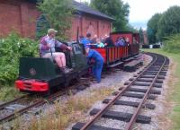 This is the opposite end of the E-shaped layout from Peters perch [see image 48001]. The locomotive is a cabless 1944 Ruston and Hornsby. Passengers were not encouraged to use the minimal platform to disembark.<br><br>[Ken Strachan 28/06/2014]