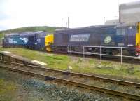 Passing shot showing DRS 20304 and 37217 resting between movements at Sellafield on 12 June 2014.<br><br>[Brian Smith 12/06/2014]