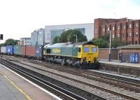 Freightliner 66517 passing through Eastleigh on 9 July with a northbound container train.<br><br>[Peter Todd 09/07/2014]