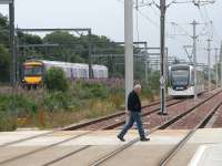 Looking west from Balgreen tram stop on 19 July 2014. The platforms were built on land once occupied by Balgreen Halt on the former Corstorphine branch. [See image 34368]<br><br>[John Furnevel 19/07/2014]