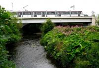 The new bridge carrying the tramway over the Water of Leith just west of Murrayfield, seen looking south on 19 July 2014. The arches of the E&G railway bridge can be seen just beyond. [See image 48066]<br><br>[John Furnevel 19/07/2014]