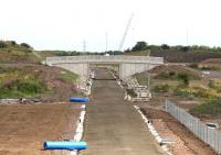 Looking north along the trackbed from Shawfair towards Newcraighall on 20 July 2014 with the new station under construction immediately behind the camera. <br><br>[John Furnevel 20/07/2014]