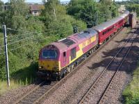 DBS 67016 passing the former Niddrie North Junction with the stock for the evening Edinburgh - Fife commuter train on 22 July.<br><br>[Bill Roberton 22/07/2014]