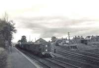 EE Type 1 no D8031 stands at Udny station on 15 August 1960 at the head of the Peterhead - Aberdeen goods. The locomotive had been delivered new to Kittybrewster shed at the beginning of the year.<br><br>[G H Robin collection by courtesy of the Mitchell Library, Glasgow 15/08/1960]