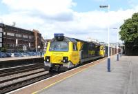 Freightliner 70015 brings a container train through Eastleigh on 9 July heading for Southampton.<br><br>[Peter Todd 09/07/2014]