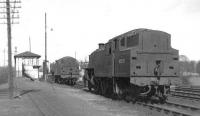 Banking locomotives at Beattock South around 1962. Fairburn 2-6-4 tanks 42693 (nearest the camera) and 42192 awaiting their next call in the sidings alongside Beattock south box. [See image 37574] <br><br>[David Stewart //1962]